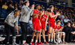 The Northeastern Huskies bench reacts during an NCAA men's basketball game at Daskalakis A...