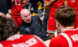 Bill Coen, the head coach of the Northeastern Huskies, addresses the Northeastern Huskies...
