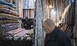 An Iranian trader stands in his fabric stall at the Grand Bazaar in southern Tehran, Iran,...