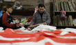 A Nepali flagmaker prints flags of a political party in Kathmandu Valley, Nepal, on Januar...