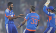 Bowler Jasprit Bumrah of India celebrates with Hardik Pandya and Sanju Samson of India dur...