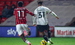 Aaron Loupalo-Bi of Walsall FC races to intercept Akin Odimayo of Crawley Town during the...