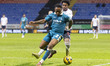 Udoka Godwin-Malife #2 of Burton Albion F.C. is challenged by Thierry Gale #11 of Bolton W...