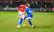 Ryan Graydon of Salford City FC is under pressure from Tom Pearce of Chesterfield FC durin...