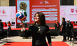A woman juggles a soccer ball during the 'FIFA World Cup 2026 Trophy Tour' event at the Mo...