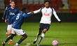 Yusuf Akhamrich of Tottenham Hotspur challenges Francis Gomez of Everton U21 during the Pr...