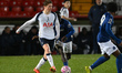Callum Olusesi of Tottenham Hotspur passes the ball during the Premier League 2 match betw...