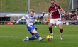Reading's Paddy Lane crosses the ball in front of Northampton Town's Nesta Guinness-Walker...