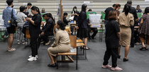 Editorial photo: A voter casts a ballot as people queue up during advanced voting in Bangkok, Thailand, on February 1, 2026. Thailand is scheduled to hold a general election on February 8, 2026, which coincides with a referendum on proposed constitutional amendments.  by Anusak Laowilas/NurPhoto