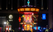 The Pop Mart carnival carousel horse ride is illuminated in front of Shanghai BFC during t...