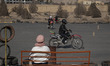 Iranian female motorcyclists wear helmets and ride motorcycles while participating in a tr...
