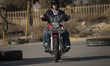 An Iranian woman, Melika, 22, rides a motorcycle during a training session at the Motorex...