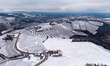 In Langhe, Piedmont, Italy, on February 3, 2026, a panorama of snow-covered vineyards appe...