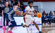 Flash Burton (11) of the Rider Broncs drives the ball during an NCAA men's basketball game...