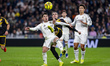Brahim Diaz of Real Madrid is defended by Pep Chavarria of Rayo Vallecano during the LaLig...