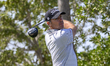 Julien Guerrier of France tees off on the 6th hole during round one of the Qatar Masters 2...
