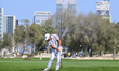 Ashun Wu of China is seen in action during round one of the Qatar Masters 2026 golf tourna...