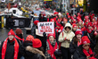 Hundreds of nurses and supporters of the New York City nurses strike hold a rally in Times...
