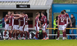 Sam Hoskins celebrates after scoring for Northampton Town, extending their lead to 3-1 aga...