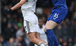 Raul Jimenez of Fulham (left) heads the ball with Jake O'Brien of Everton (right) during t...