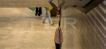 Gallery cover photo: Smiling Face And Passing Legs In Reflection