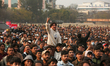 Nepali cricket fans react while watching the live screening of the match between Nepal and...