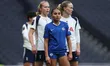 Alyssa Thompson of Chelsea (center) is marked by Tottenham Hotspur Women players during th...