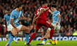Ryan Gravenberch of Liverpool takes on Manchester City's Nico O'Reilly during the Premier...
