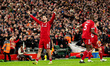 Dominik Szoboszlai of Liverpool salutes the fans after scoring during the Premier League m...