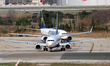 A Ryanair Boeing 737 MAX 8-200 and a Ryanair Boeing 737-8AS maneuver on the runway at Barc...