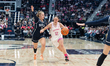 Ashlynn Shade #12 of the Connecticut Huskies drives to the basket for a layup during an NC...