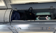 Luggage are seen in the overhead compartment at the Tirana International Airport in Tirana...