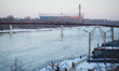 People walk along the Vistula river in Warsaw, Poland on 9 February, 2026. 