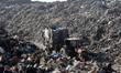 Palestinians transport garbage at a landfill in the Firas Market area of Gaza City, on Feb...