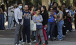 Dozens of people wait to be seen by medical personnel in Mexico City, Mexico, on February...