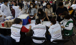 Dozens of people wait to be seen by medical personnel in Mexico City, Mexico, on February...