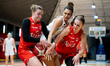 Zuzanna Kulinska, Eve Wembanyama, and Aleksandra Ziemborska play during the basketball gam...