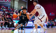 Braeden Speed of the Loyola-Maryland Greyhounds drives the ball during an NCAA men's baske...