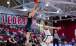 Jacob Theodosiou (6) of the Loyola-Maryland Greyhounds attempts a three-point field goal d...