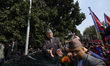 Former Nepali King Gyanendra Bir Bikram Shah greets his supporters as he exits the Tribhuv...