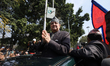Former Nepali King Gyanendra Bir Bikram Shah greets his supporters as he exits the Tribhuv...