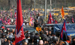 Former Nepali King Gyanendra Bir Bikram Shah greets his supporters as he exits Tribhuvan I...