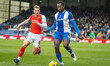 Oldham Athletic's Manny Monthe and Fleetwood Town's Will Davies participate in the Sky Bet...