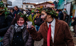 Men and women wear costumes during the festival in Satriano di Lucania, Italy, on February...