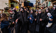 Men and women wear costumes during the festival in Satriano di Lucania, Italy, on February...