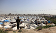 A photograph shows tents at a makeshift camp sheltering displaced Palestinians in the Zeit...