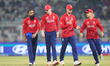 Harry Brook, the captain of England, stands with Adil Rashid of England and team England d...