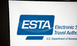 The ESTA Electronic System for Travel Authorization logo is displayed on a computer screen...