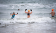 Winter swimmers take a cold-water dip in the Baltic Sea during winter conditions in Gdansk...