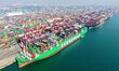 A cargo ship loads and unloads containers at Qingdao Port in Qingdao City, Shandong Provin...